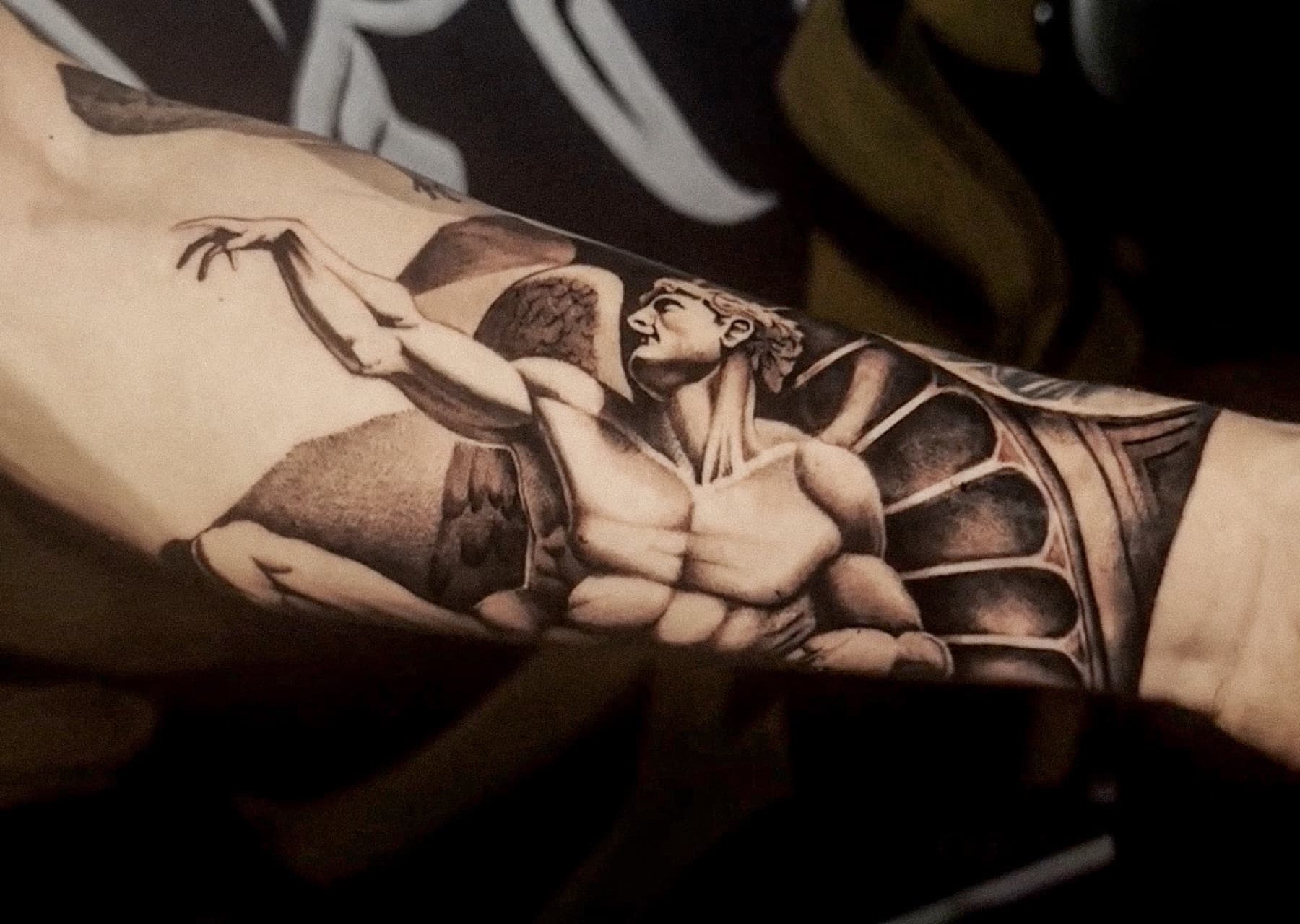 Black and grey forearm tattoo detail