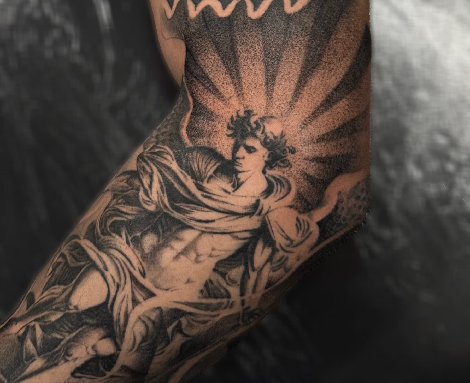 Black and grey realistic tattoo on hand