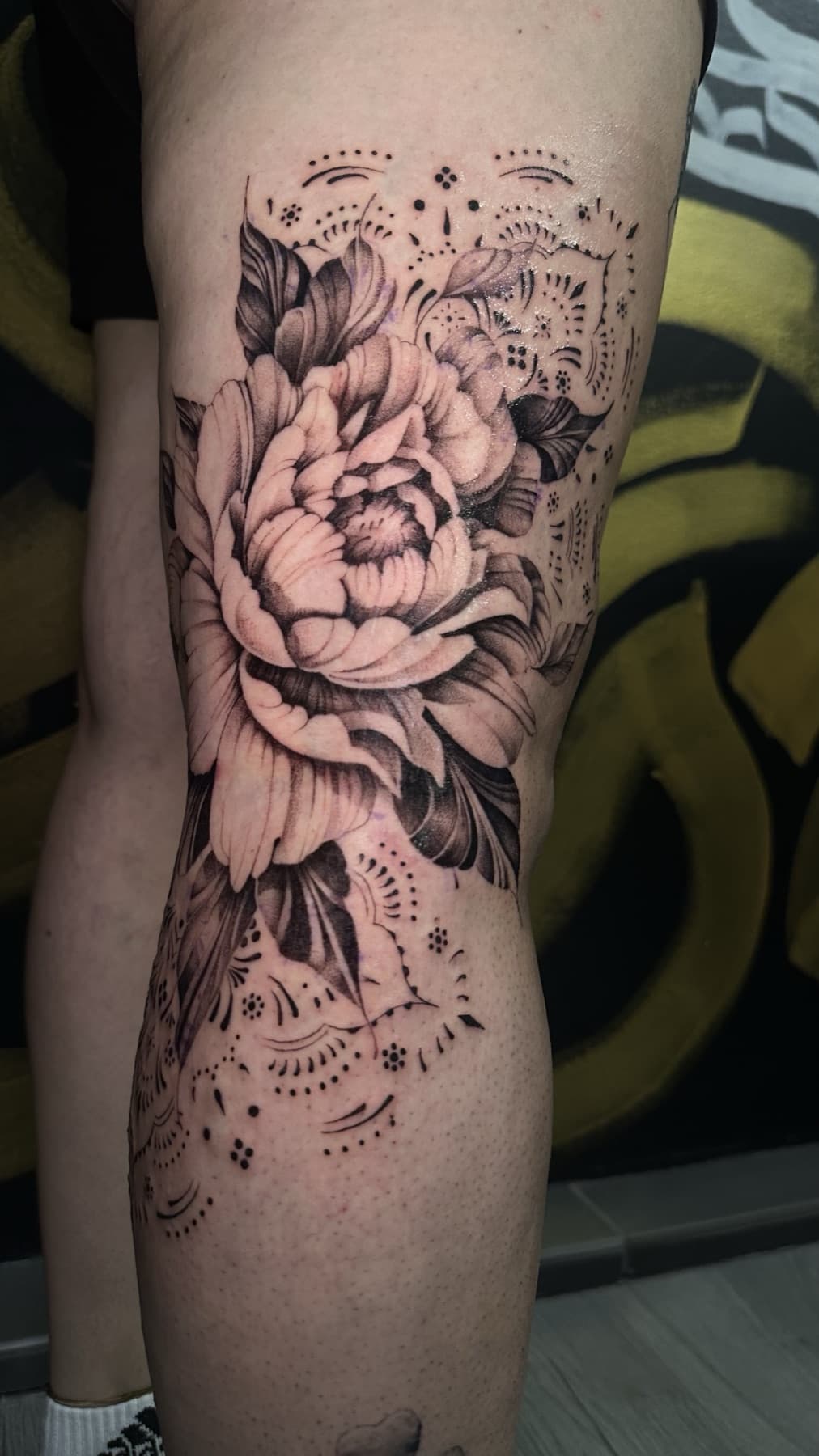 Floral black and grey leg tattoo