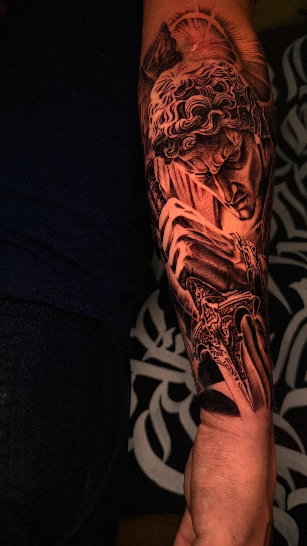 Black and grey tattoo detail from Infinity Tattoo